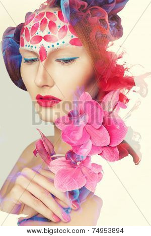 Creative shoot. Beautiful fashion woman With Conceptual Creative Makeup With Dispersion Effect
