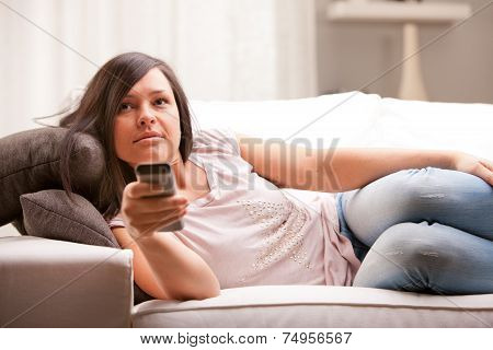 Girl Changing Programme On Her Television