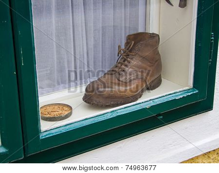 an old shoe in a window