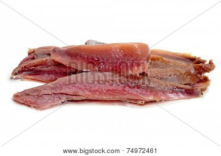 some marinated anchovy fillets on a white background