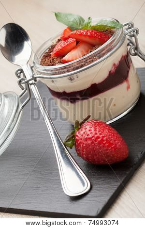 Delicious Italian Cream Dessert Pannacotta With Grated Chocolate, Strawberry, Basil