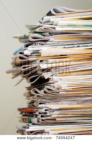 Big pile of newspapers, focus in front