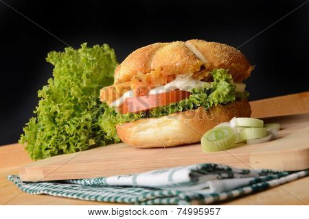 Appetizing fish burger with leek