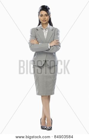 Businesswoman standing with her arms crossed