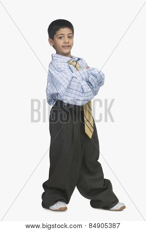 Portrait of a boy wearing oversized clothes