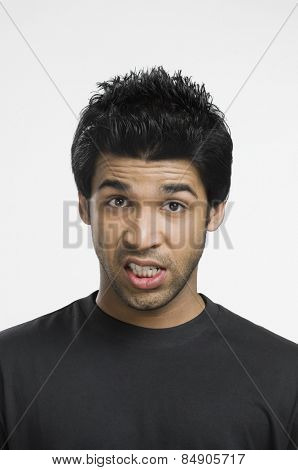 Portrait of a man grimacing