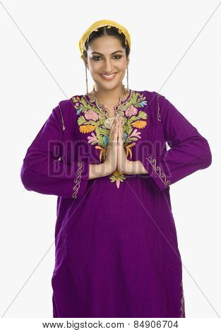 Woman in traditional Kashmiri dress greeting