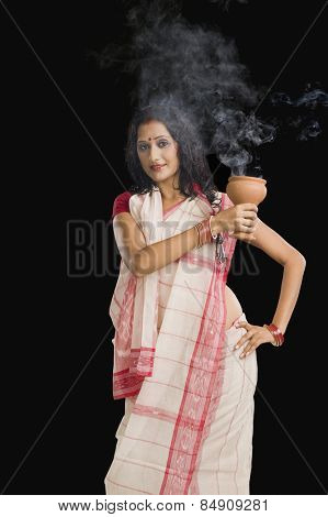 Bengali woman performing ritual dance