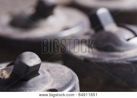 Close-up of old lightswitches