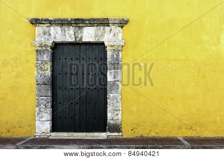 Yellow wall and green door
