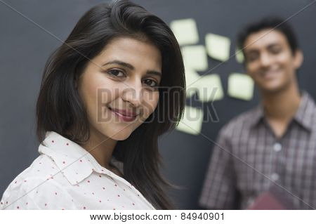 Portrait of a female college student smiling with her friend