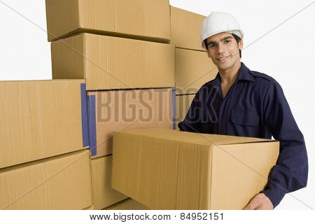 Warehouse worker carrying a cardboard box