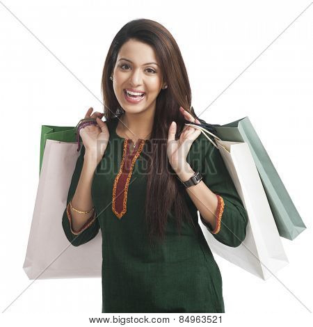 Portrait of a happy woman carrying shopping bags