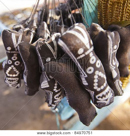 Shani Dev souvenir hanging at a market, Shani Shingnapur, Ahmadnagar, Maharashtra, India