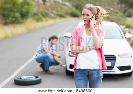 Couple after a car breakdown at the side of the road