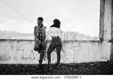 Couple of hip-hop afroamerican on undergraund. Black and white photo