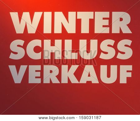 Label with inscription in German Winter clearance saleon red background.