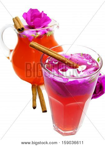 rose punch tea cocktail punch in jug and cup with cinnamon