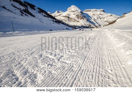 Alpine winter mountain landscape. French Alps covered with snow in sunny day. Val-d'Isere, France