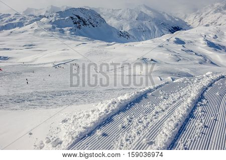 Alpine winter mountain landscape. French Alps covered with snow in sunny day. Val-d'Isere, France