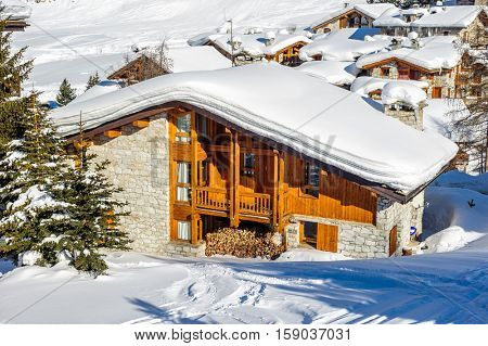 Alpine winter mountain landscape. French Alps covered with snow in sunny day. Val-d'Isere, France