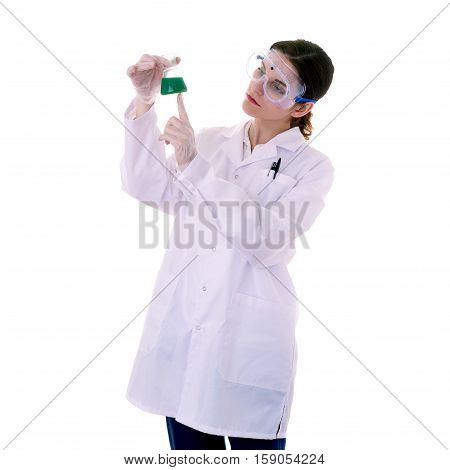 Female assistant scientist in white coat and plastic protective glasses over white isolated background inspecting flask filled with substance, healthcare, profession, science and concept