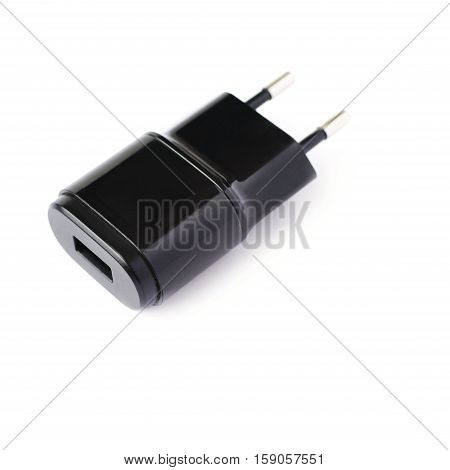Black usb adapter charger isolated over the white background