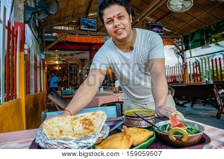 Indian chef serving food on Sony a6300 29, 9 fps HD