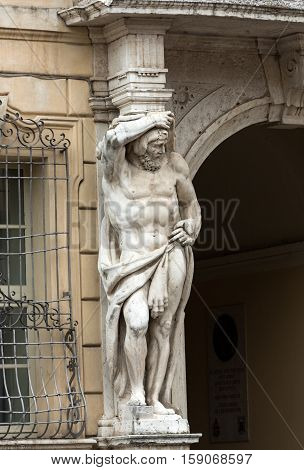 Statue of Hercules at the entrance to the 18th century Palazzo Vescovile (Bishops Palace) in the historical center of Mantua Ital