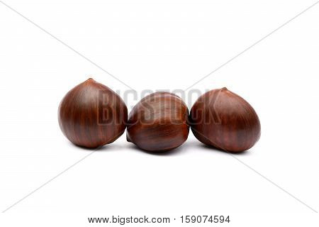 Fresh brown chestnuts isolated on white background