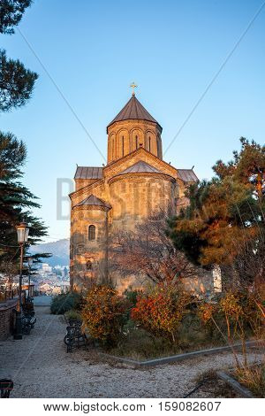View Metekhi Church in the morning above the Kura river in Tbilisi Georgia.