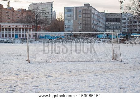 Soccer goal in the winter in the city in the daytime
