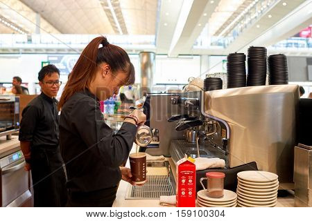 HONG KONG - CIRCA NOVEMBER, 2016: barista prepare coffee at a McCafe in Hong Kong. McCafe is a coffee-house-style food and drink chain, owned by McDonald's.