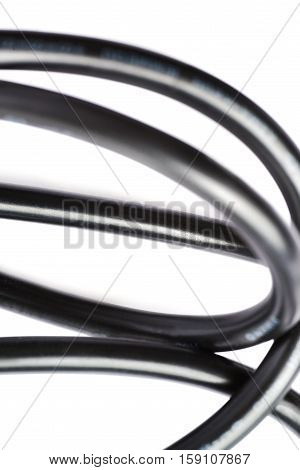Black electric computer power supply cable isolated over white background