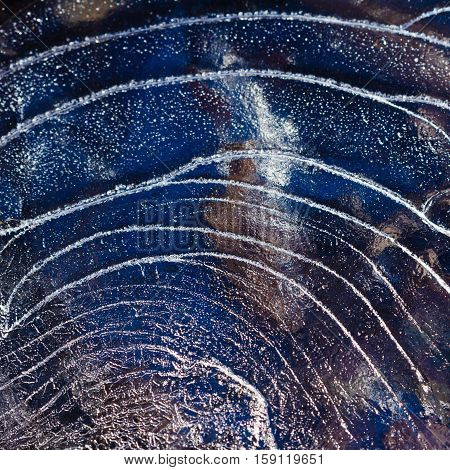 Ice pattern background on the surface of the pond or river. Macro frost crystal winter design
