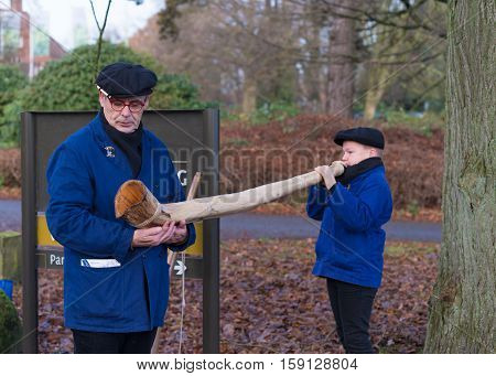 OLDENZAAL NETHERLANDS - NOVEMBER 27 2016: Unknown young boy blowing a so called 