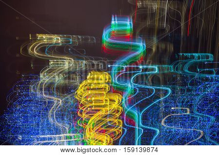 Abstract background made of Christmas lights with long exposure.