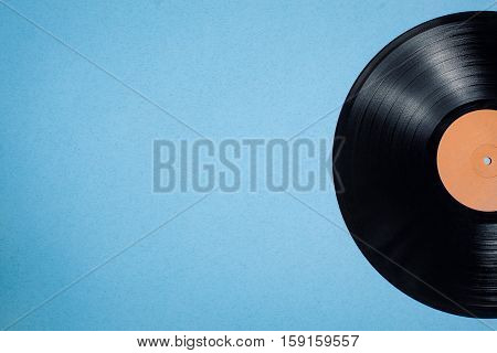 Vinyl Musical Disc On Blue Background;