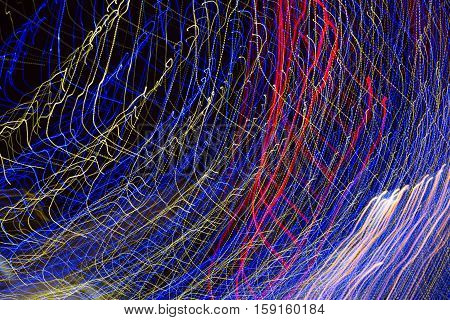 Abstract background made of Christmas lights with long exposure.
