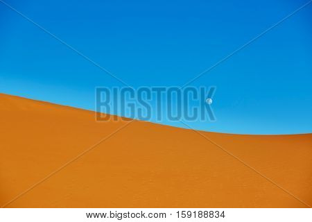 Sand Dunes And Almost Full Moon