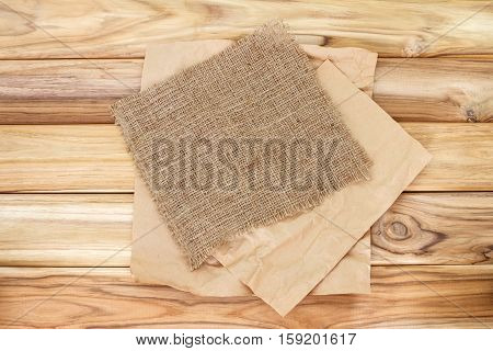 Crumbled cooking or baking paper sheet place on wooden table
