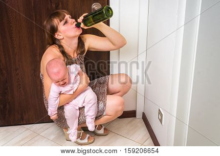 Drunk Reckless Woman Drinking Alcohol And Holding Her Baby