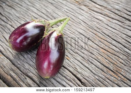 Group of eggplant on old wood background