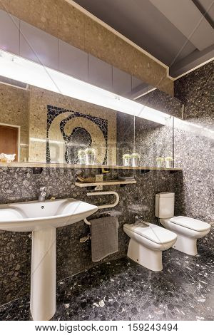Ethnic Bathroom With Sink And Big Mirror