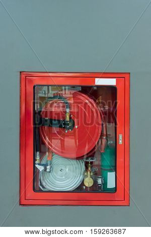 Hydrant with water hoses and fire extinguish equipment Fire fighter equipment in the red box