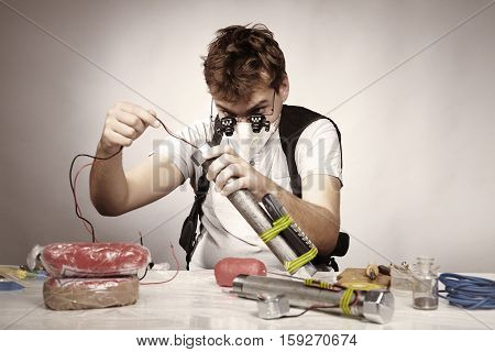Man making classic type of tube bomb at home