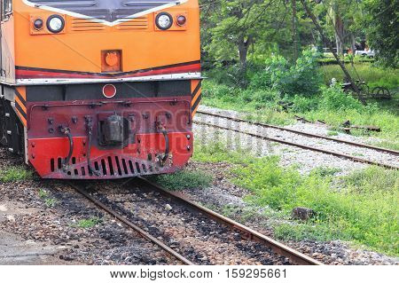 locomotive train running on rails station of in travel in Thailand