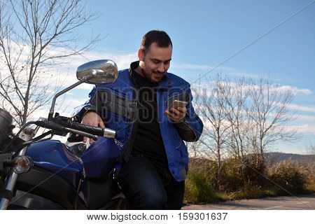 Biker Talking By Phone With His Smarth Phone