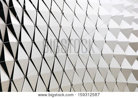 Abstract close-up view of modern aluminum ventilated triangles on facade