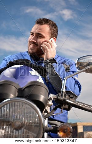 Biker Talking By Phone With His Smarth Phone